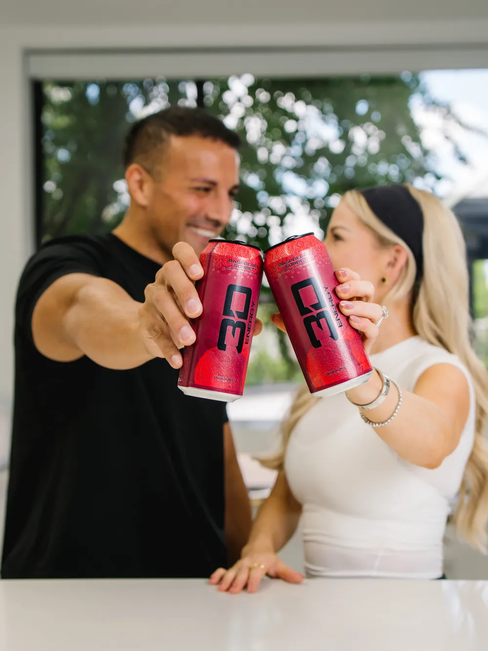 3d Energy Raspberry Couple Cheers Cans Lifestyle