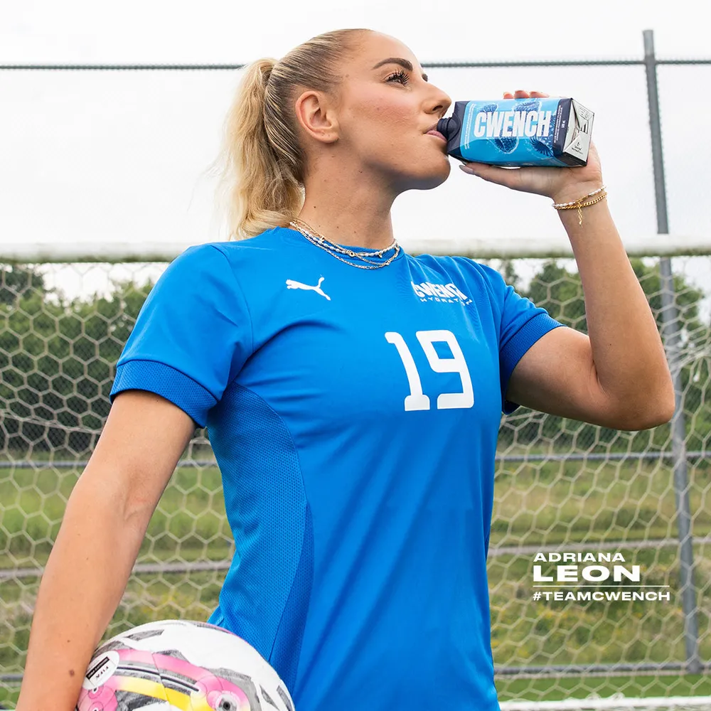 cwench hydration soccer player drinking carton