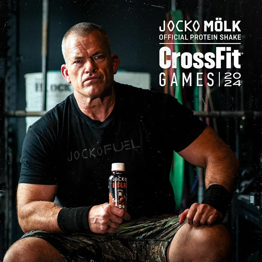 Jocko Willink holding a MOLK protein shake RTD bottle