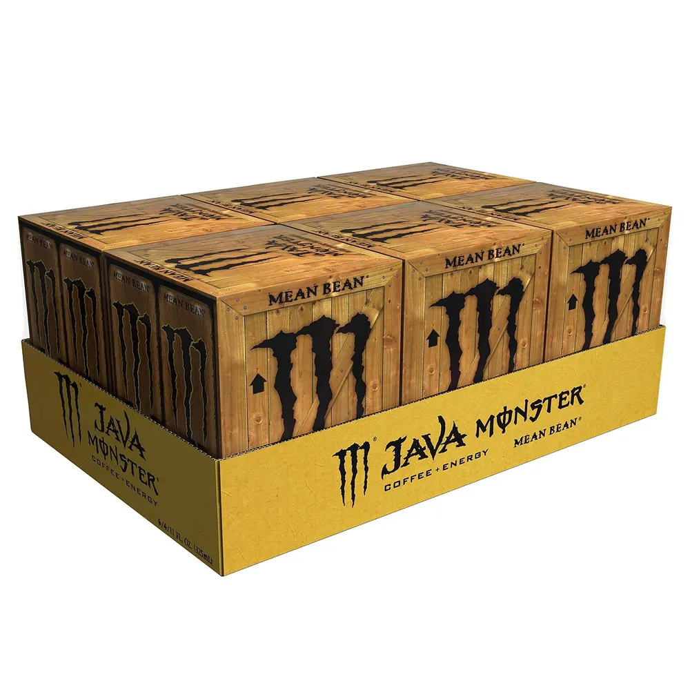 A cardboard display tray holds several brown, woodgrain-patterned Java Monster cans